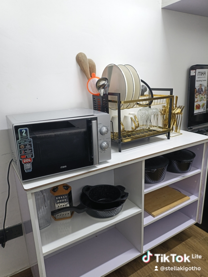 Microwave and dishrack with pans