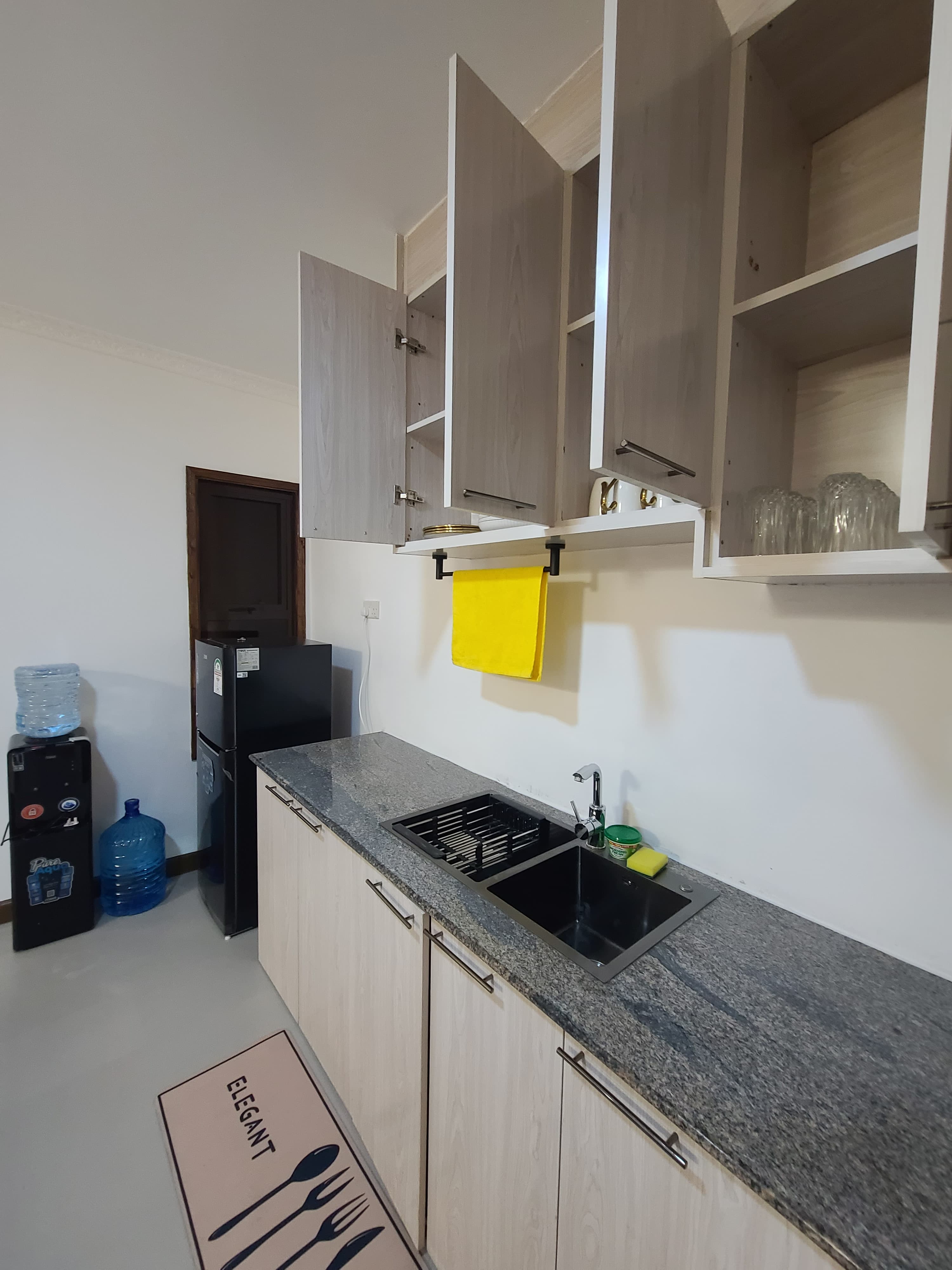 Sink with water dispenser and fridge