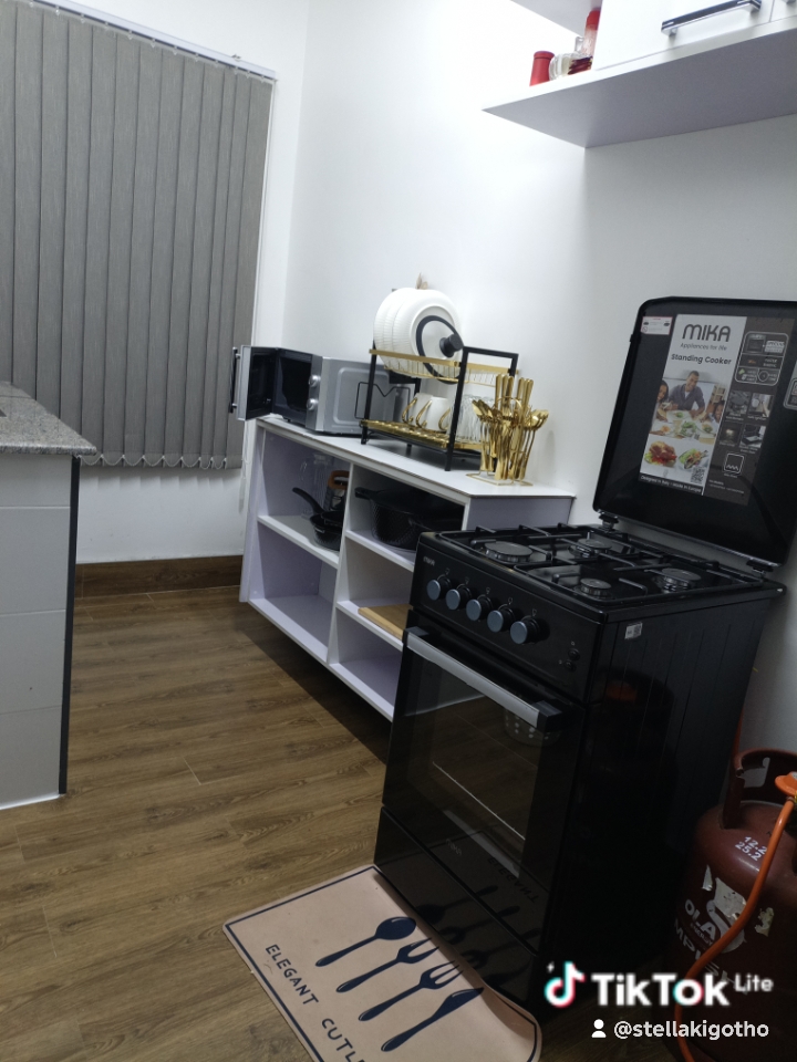 Stove microwave and wood floor