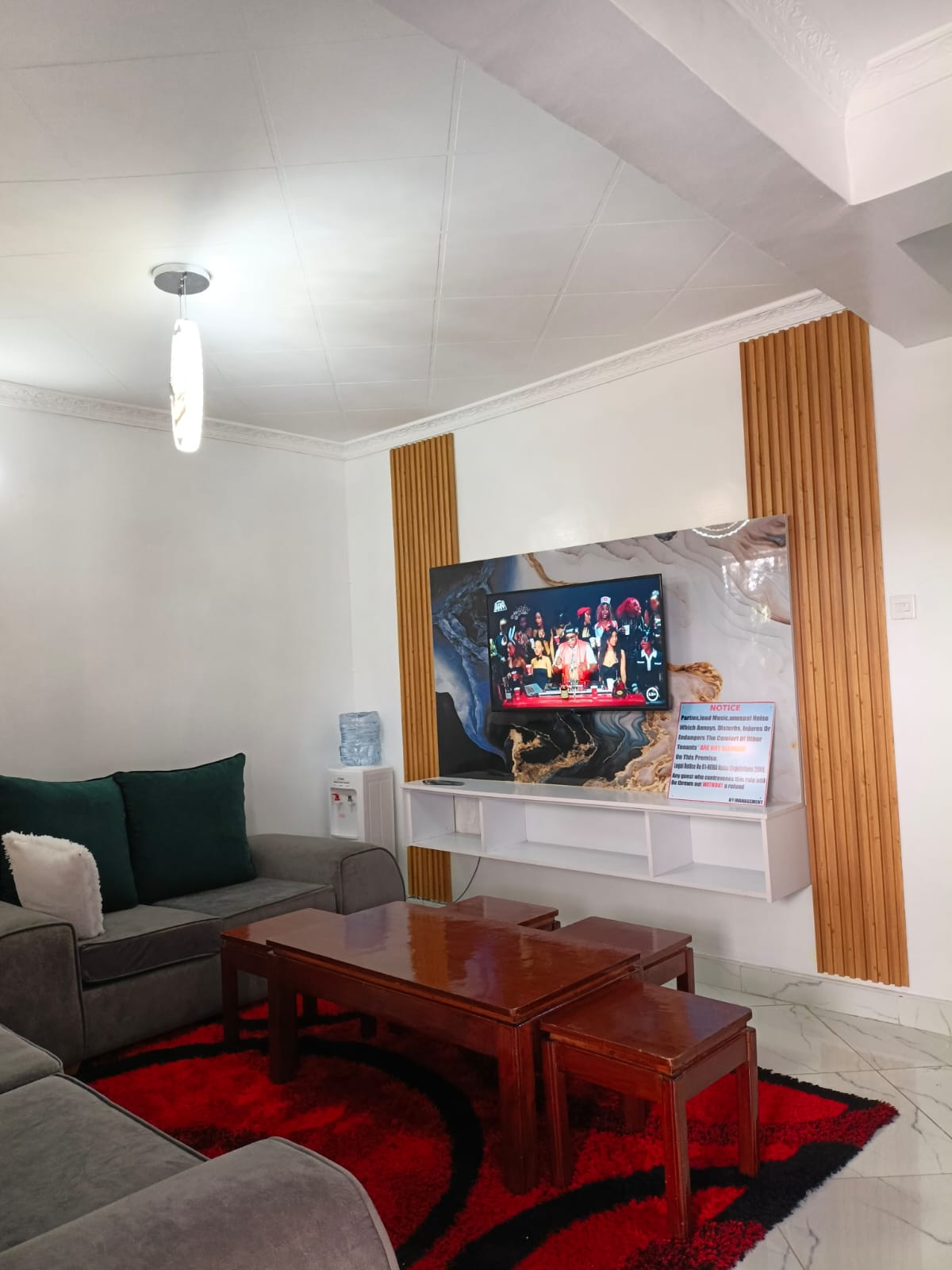 Grey sofa with marble TV wall